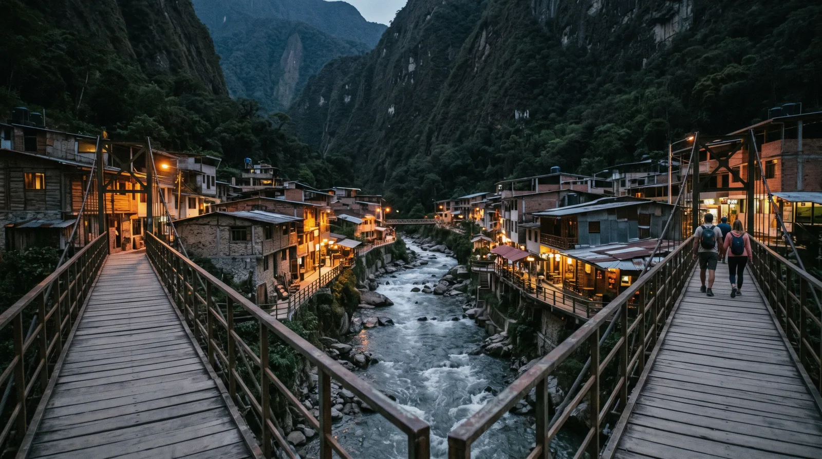 Aguas Calientes town in the gorge below Machu Picchu, with the Vilcanota River and steep green slopes around it