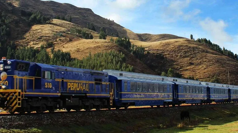 Train winding through the Andes toward Aguas Calientes on the way to Machu Picchu, Peru
