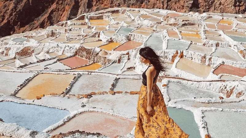 Small tour group visiting the Maras salt mines on a 2-day Sacred Valley and Machu Picchu trip, Peru