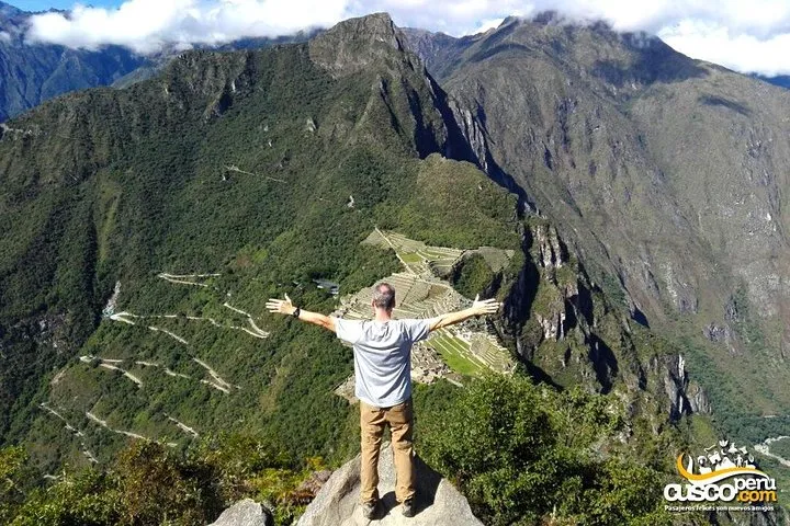 Climbers ascending the steep steps of Huayna Picchu above Machu Picchu, Peru